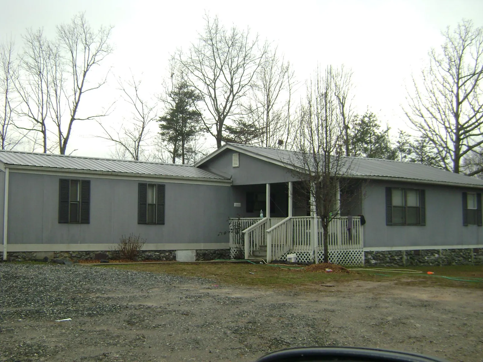 Metal roof over a manufactured home with a covered front porch in Palisade